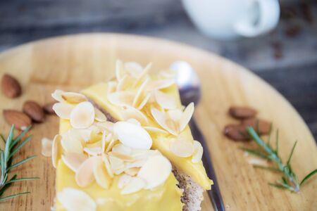 Cake on wooden tray with coffee cup background.の写真素材