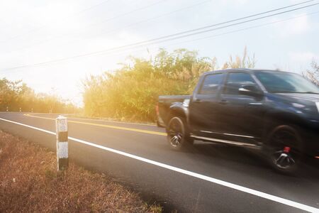 Car on street in the countryside with the traveling at sunlight.の写真素材