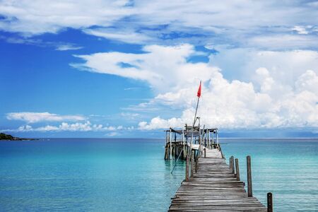 Wooden bridge on sea with the blue sky background.の写真素材