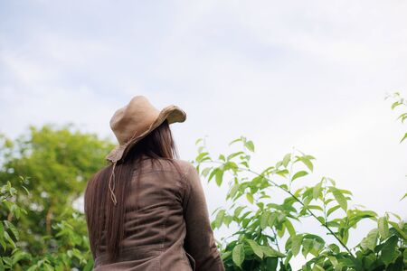 Young woman of asian in park with the sky.の写真素材
