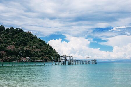 Wooden bridge on beach at sea with the sky.の写真素材
