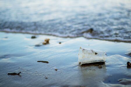 Rubbish with dirt on beach at the sea.の写真素材