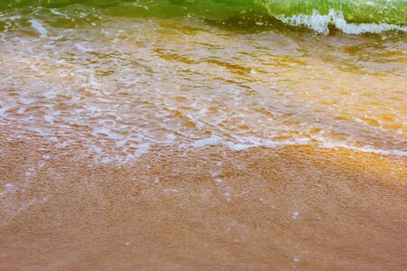 Water waves on beach at the sea.の写真素材