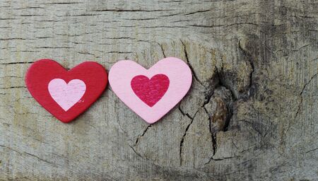 Two hearts on the old wooden floor.の写真素材
