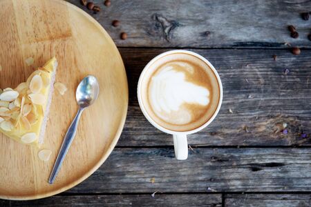Coffee cup and cake on wooden with top view.の写真素材