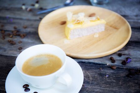 Coffee cup and cake on wooden background.の写真素材