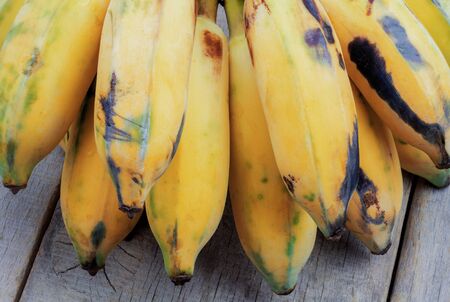 Banana of ripe on a wooden background.の写真素材