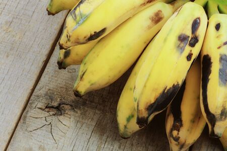 Banana of ripe on wooden floor.の写真素材