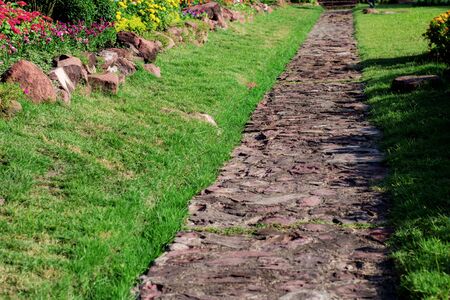 Stone of pathway with sunlight in the garden.の写真素材