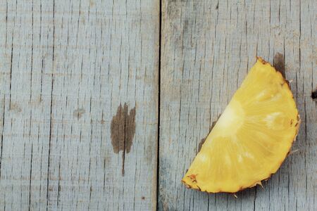 Ripe of pineapple sliced on a wooden.の写真素材