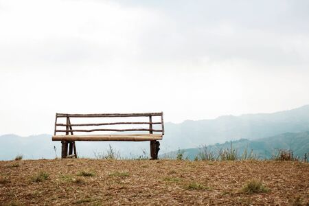 Bamboo seats on hill and mist in the morning.の写真素材