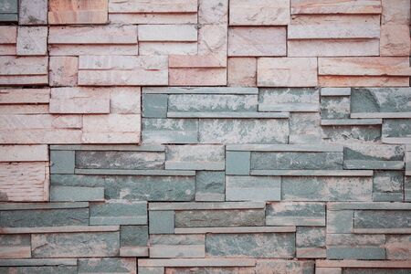 Brick wall with colorful details on the background.の写真素材