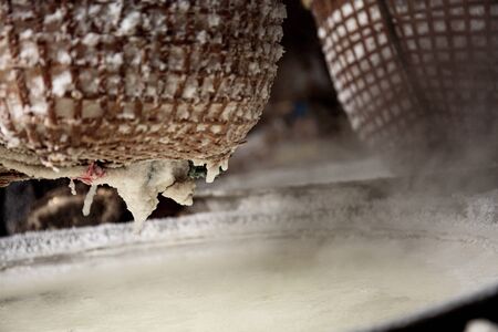 Basket salt of holding on firewood with texture at home.の写真素材