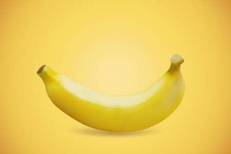 Banana ripe on a yellow background.の写真素材