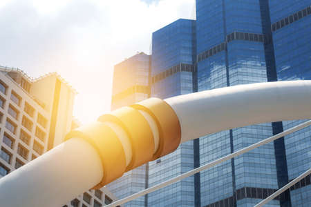 Bridge with office building at sunlight.