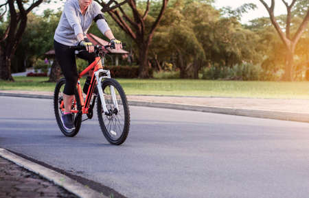 Women are cycling with nature in the park.の写真素材