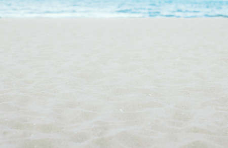 White sand on beach with the sea background.の写真素材