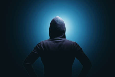Hackers with the back on a dark background.の写真素材