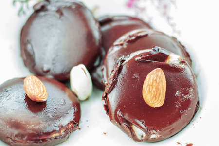 Chocolate and almond with a white background.の写真素材