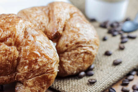 Croissant and cups of coffee on the sack.の写真素材