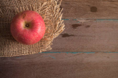 Apple on the old wooden floor.の写真素材