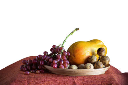Grapes and fruits on tray with a white background.の写真素材