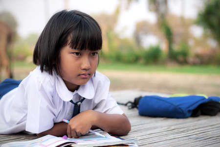 Student girl in the countryside of Thailand.の写真素材
