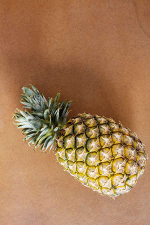 Pineapple of ripe on wooden floor.