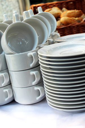 White plates and soup cupsの写真素材