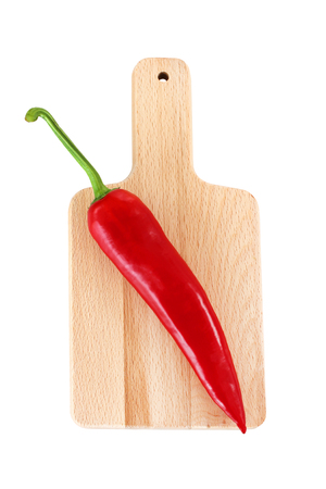 Red pepper on the cutting boardの写真素材