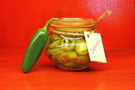 Chilli Jalapeno preserved in jar for sale.の写真素材