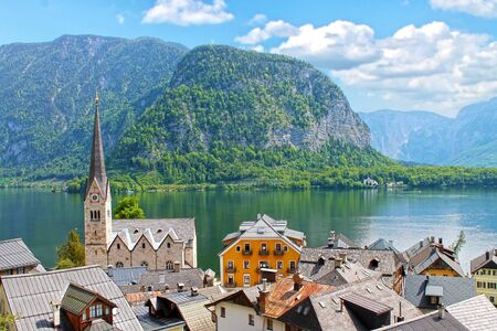 View of the Hallstatt village from Lake Hallstater See in Alps. Austria. Popular tourist...