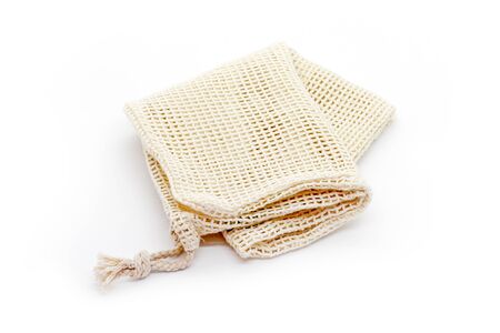 Eco natural bags for sale fruits and vegetable on white background. Plastic free lifestyle.の写真素材