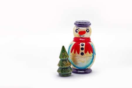 Traditional wooden russian toy. Nesting dolls - snowman and christmas tree. Popular souvenir from Russia.の写真素材