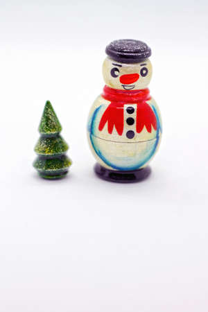 Traditional wooden russian toy. Nesting dolls - snowman and christmas tree. Popular souvenir from Russia.の写真素材