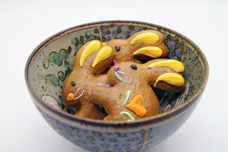 Easter gingerbread cookies in the shape of a bunny in a bowl. View from above.の写真素材