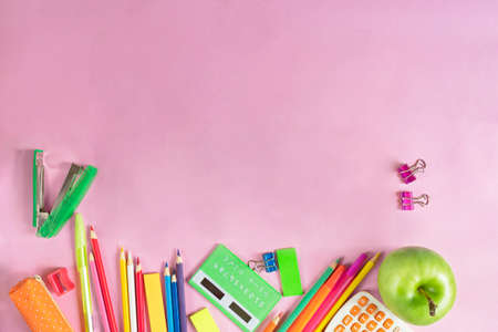 School supplies pink background for paper design. Pink background. Isolated objects.