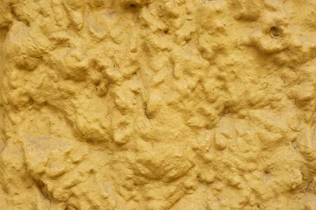 Yellow stained cement with patina and cracks. Grunge background.の写真素材