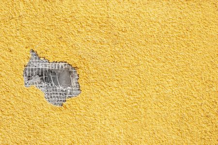 yellow rough stucco, deeply punched. material texture.の写真素材