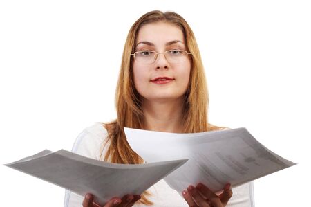 Young girl with sheets of paper in her handsの写真素材
