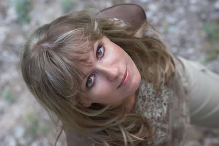 young cute blond woman. shooting from upside. selective focus.の写真素材