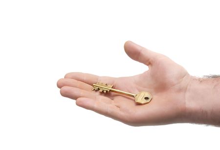 big door key lying on man's palmの写真素材