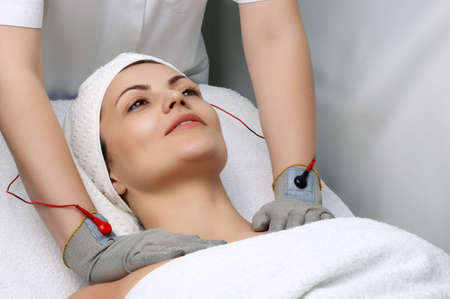 woman getting special electric massage in the beauty salon