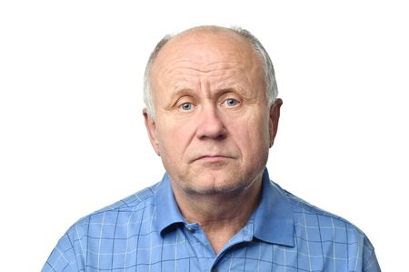 quiet senior bald man isolated on whiteの写真素材