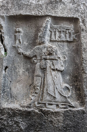 Rock carving in Yazilikaya depicting god Sharruma and King Tudhaliya dated to around 1250 - 1220 BC のeditorial素材