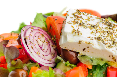 closeup of greek salad with large piece of fetaの写真素材