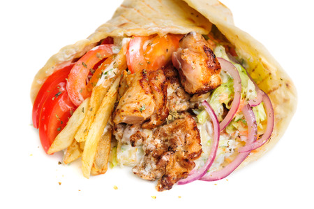 greek gyros stuffed with meat, salad, onion, tomato and potatoの写真素材