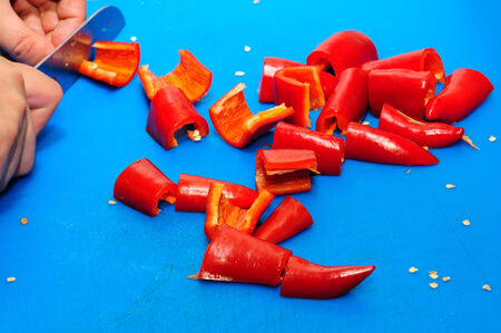 cutting red pepperの写真素材