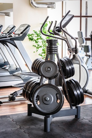 Barbell plates rack in the gym