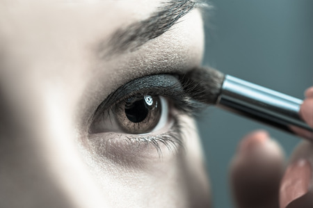 Applying perfect makeupの写真素材